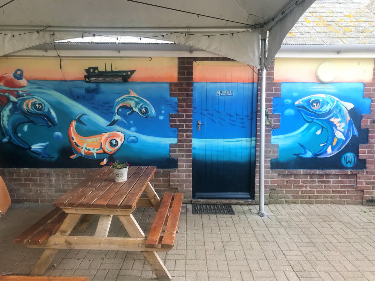 LongsBridport's tweet photo. We are delighted to unveil this wonderful artwork outside our King Street shop created by local #artist Marina Renee-Cemmick. We will be serving meals from Monday with outside seating available at both shops and most of King St. undercover. 
We hope to seeing you soon! #Bridport https://t.co/H2dS0Xy63o