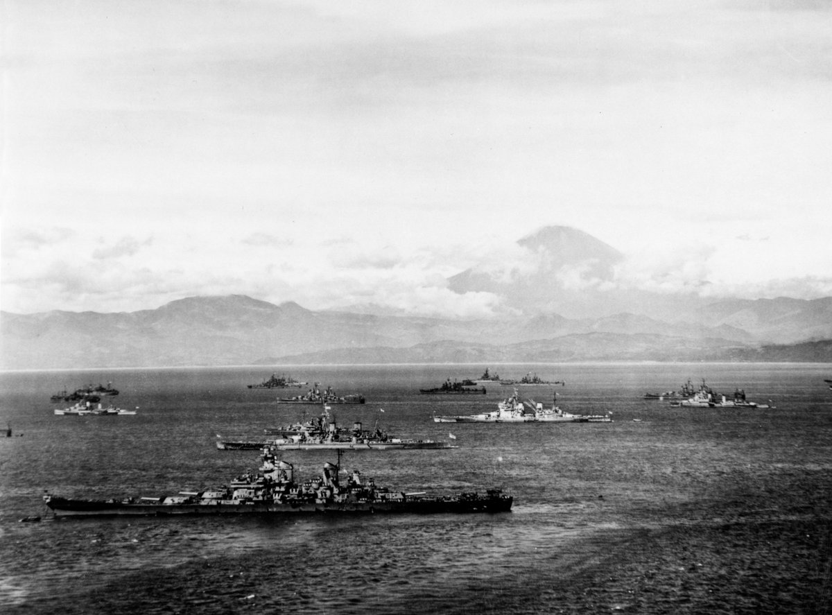On completion, Whelp escorted HMS Duke of York to Guam. In August the Allied fleets sailed for Tokyo, with Whelp allegedly the first Allied ship to enter Sagami Bay, outside Tokyo Harbour. Naval History and Heritage Command. DoY is 2nd ship from front. Mt Fuji in background.