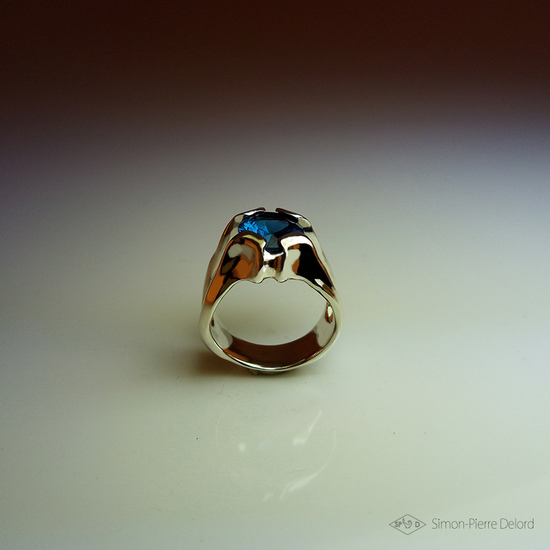 Simon_Delord's tweet photo. Jewelery creation entitled "Drop of Lagoon". A 3.5 Carat London Blue Topaz (Treated) is set in an organic frame chiseled in Argentium (925 Silver). The Universe of this creation is fantasy exobiology. Made in Cordes-sur-Ciel in the Tarn. https://t.co/AelBOsuIEu