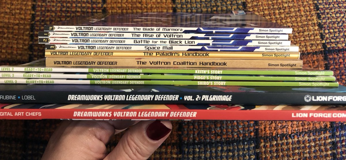 These are the books I have to draw from: the first two trade paperbacks of comics, three of the early readers about a character, four of the kids' chapter books, the Paladin Handbook and the Voltron Coalition Handbook.