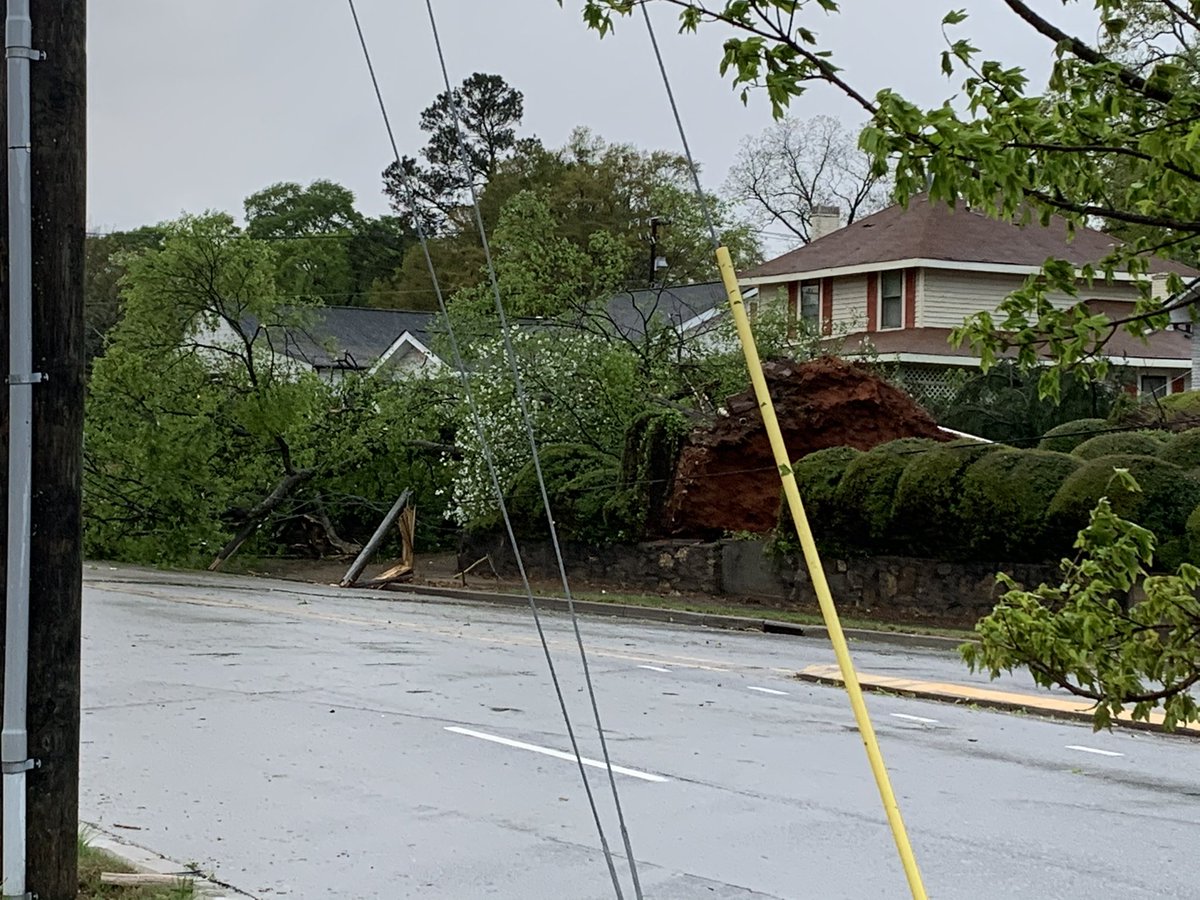 CodyAlcorn's tweet photo. Hey @NWSGSP I’m on Stone Avenue in downtown @CityGreenville with quite a bit of damage. Even a tree thrown into a tree. #severeweather https://t.co/3DUYdfoBUe