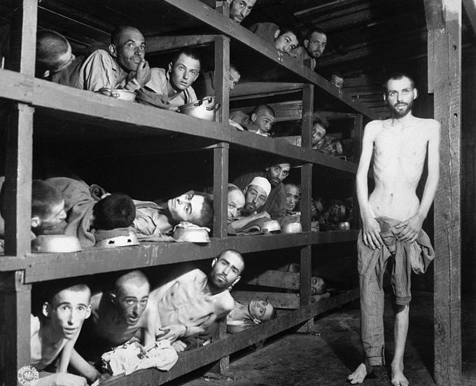 In this famous image, you can see former prisoners of the "little camp" in  #Buchenwald who stare out from the wooden bunks. In the second row of bunks, seventh from the left, next to the vertical beam is Elie Wiesel who had been transferred there from  #Auschwitz.