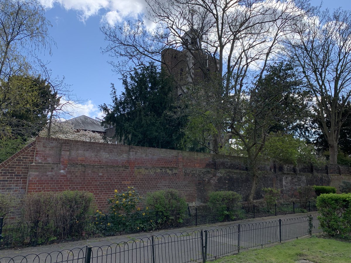 Dee is said to have been buried in the church next door, which was built in 1543 (although all that remains of the original structure is the bell tower). The wall separating the flats from the churchyard is supposedly the wall that once ran along the edge of his garden.