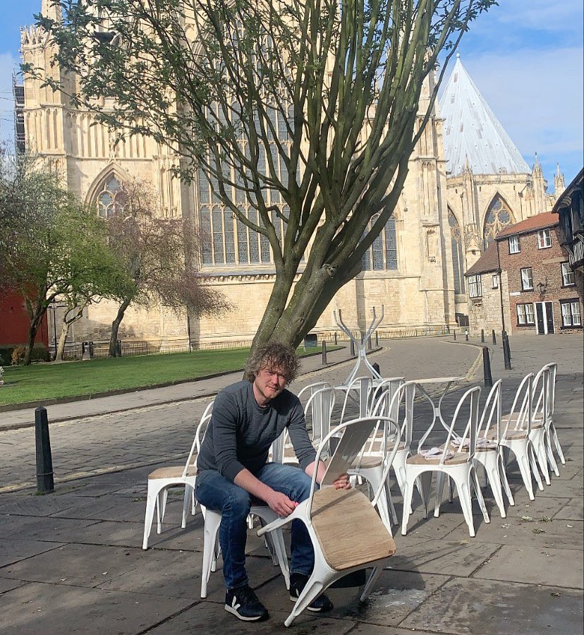 Tom getting all our pretty tables &amp; chairs ready for tomorrow, we’ll be open  from 10.00am. Coffee, cake &amp; this view 🧁x #onlyinyork #coffee #cupcakes #MondayMorning #COVID