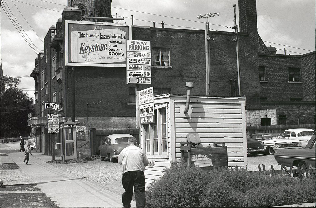 Same view, then & now.The hotel building endures - today an EconoLodge.The parking lot/building site is now a townhome complex that runs through the block to George St.