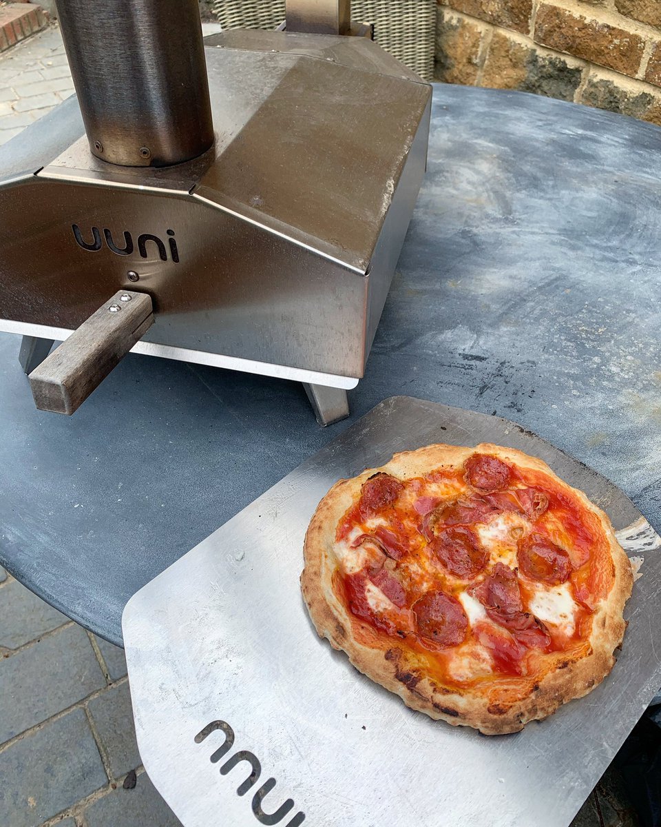 Homemade pizzas with friends yesterday, made on our <a href="/OoniHQ/">Ooni</a> in the interesting spring weather we’ve got right now. Most disappeared too quickly to get a photo but I’ll read that as a sign they went down well #ooni #pizza
