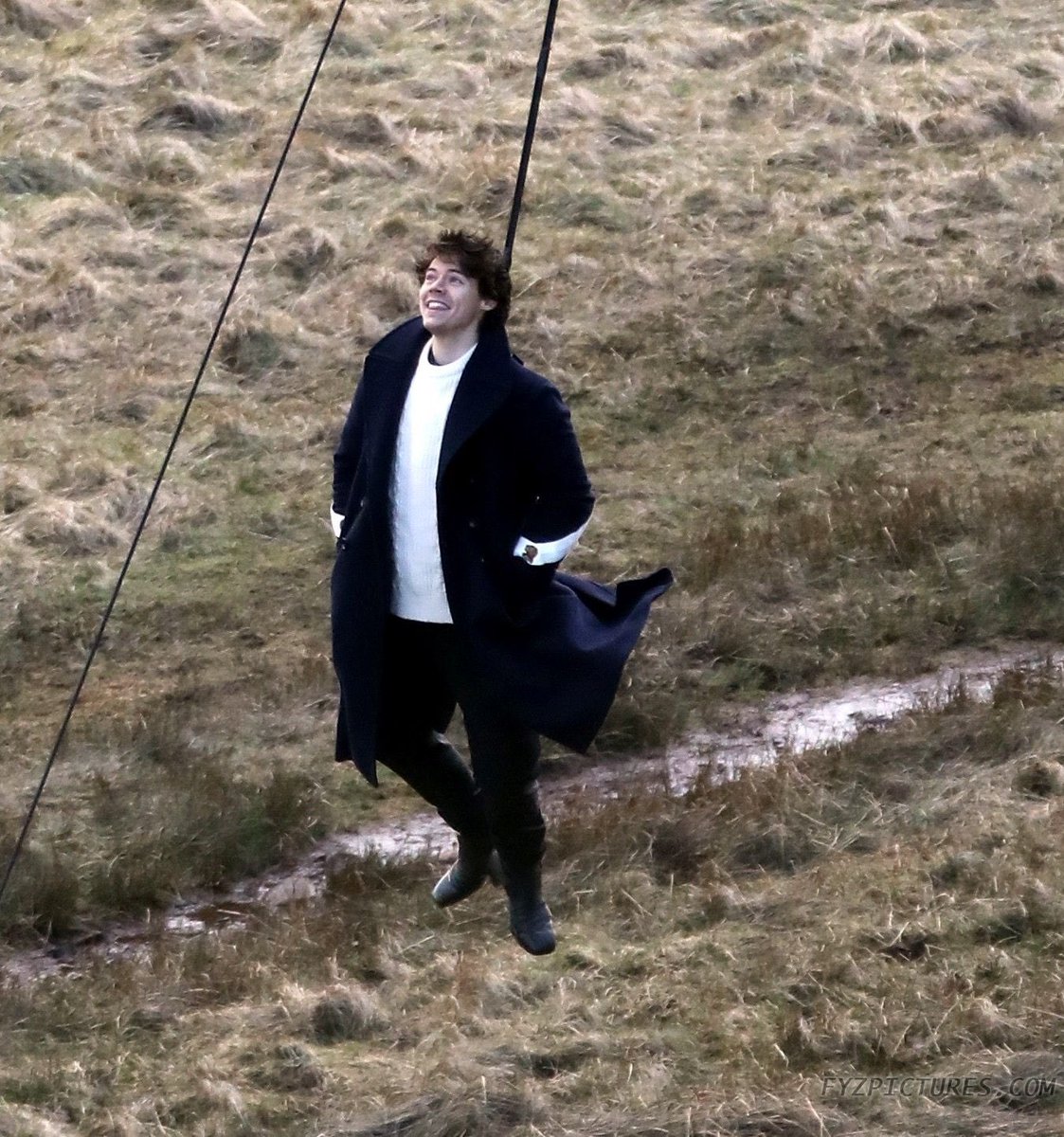 hanging 500 feet up in the air by a helicopter for the music video of his debut single, sign of the times