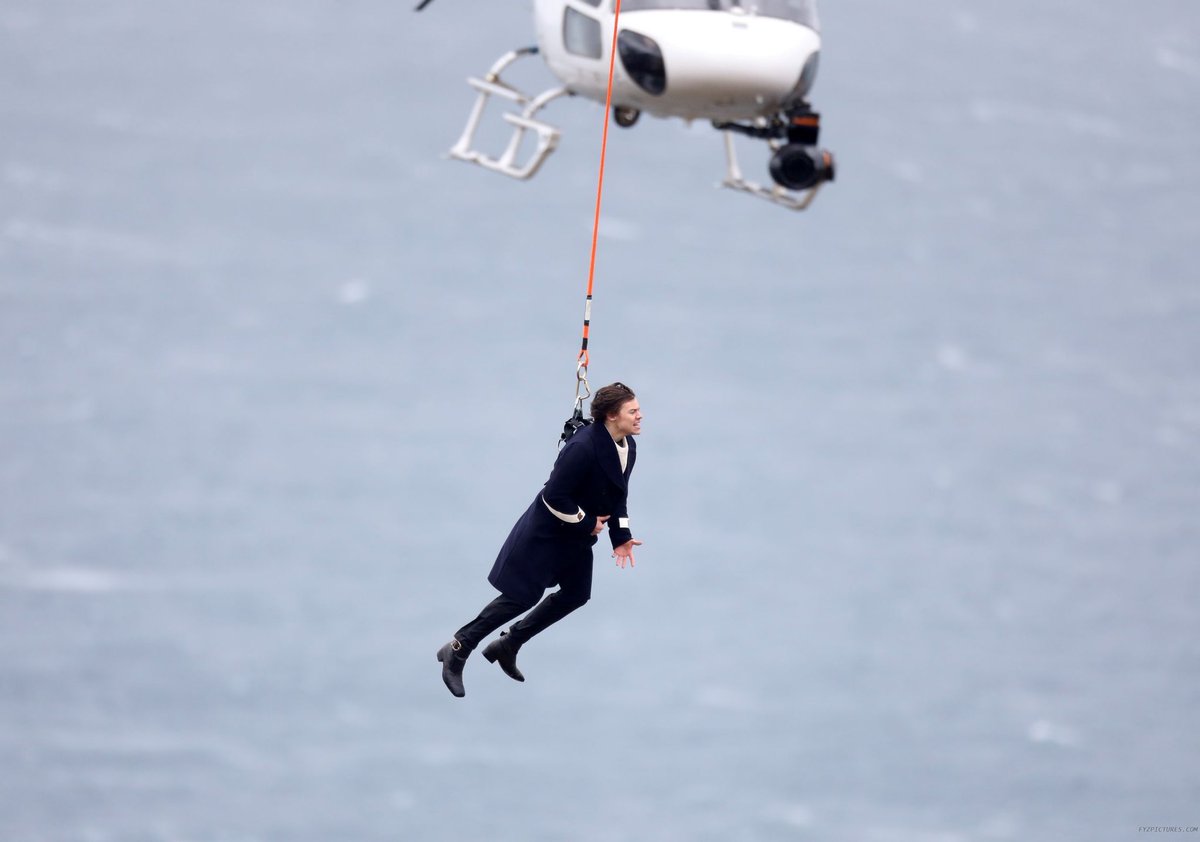 hanging 500 feet up in the air by a helicopter for the music video of his debut single, sign of the times