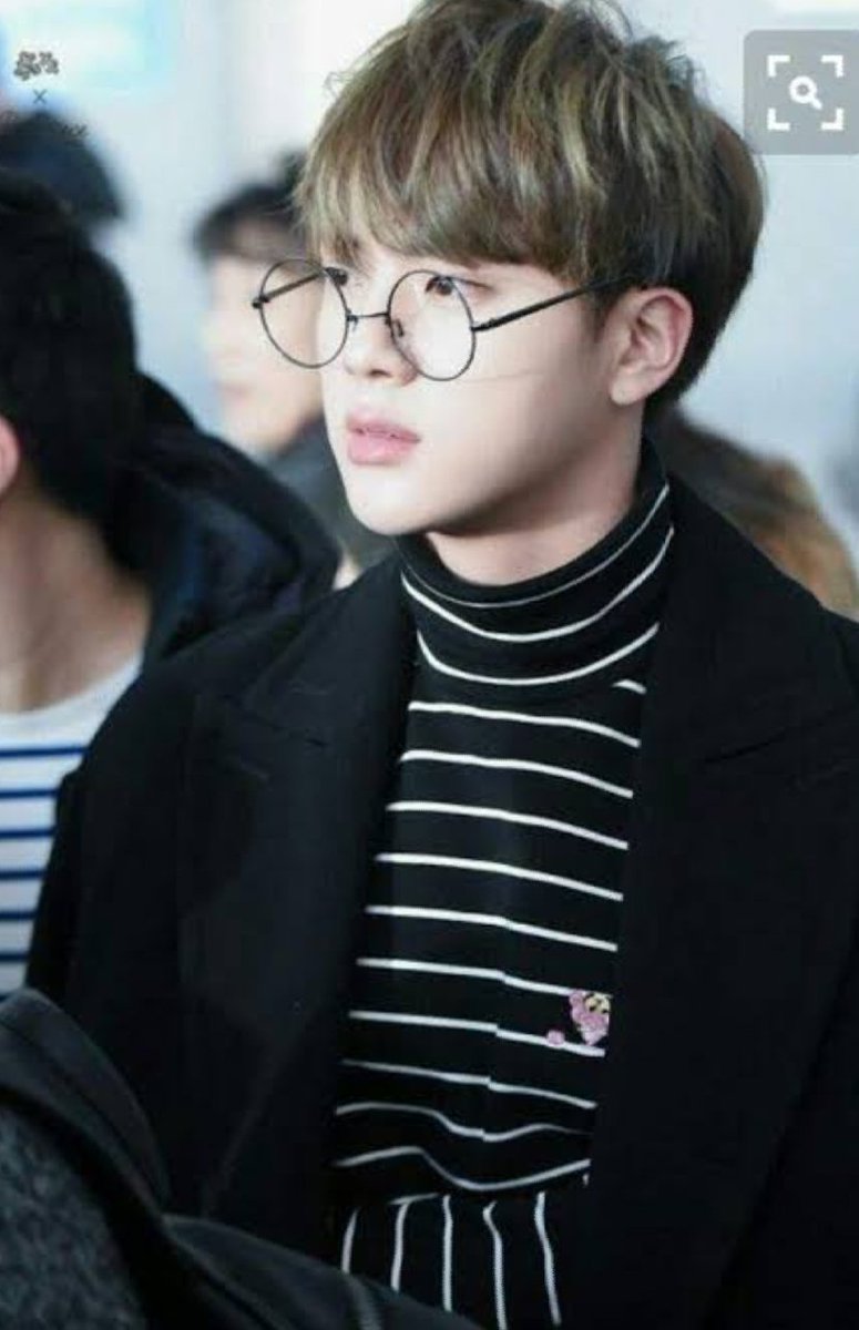 Turtle neck top with round glasses