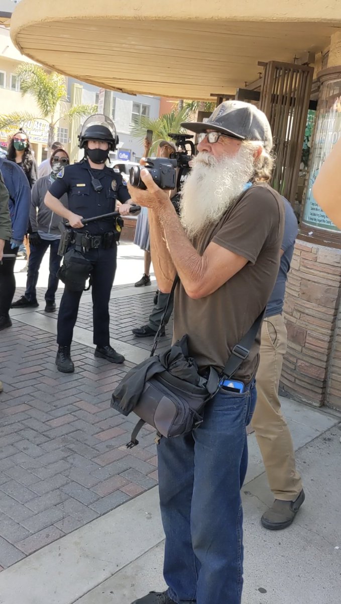 This guy earlier was screaming at a woman journalist really aggressively for supposedly taking a picture of him. He claims he's been a photojournalist for 40 years, if that were true he would have known that was unacceptable behavior