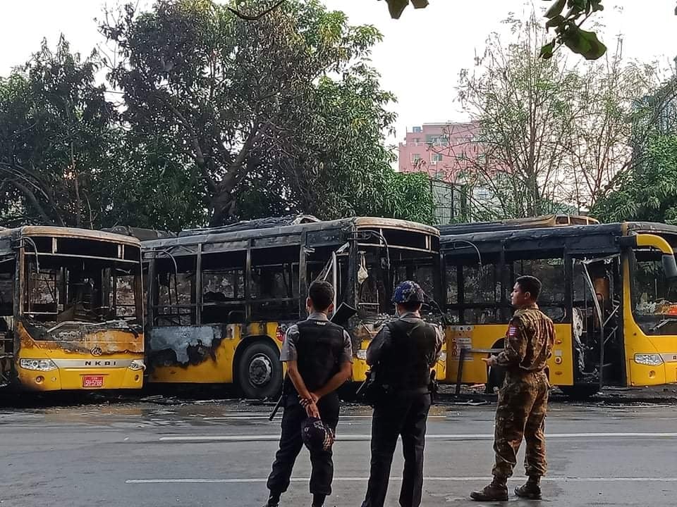 IrrawaddyNews's tweet photo. A number of buses belonging to the Yangon Bus Service (YBS), the city’s public transport line, were set alight in Kyimyindaing Township on the morning of Apr. 12. 
#WhatsHappeningInMyanmar https://t.co/Ph3F0w0vcw