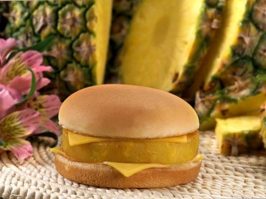 we all laugh about "cursed food" and market failures, but there is seriously something deeply, deeply unsettling about the McHula. A slice of hot pineapple between two pieces of american cheese on a bun. No burger. This is, for my money, the most disturbing cursed food yet made