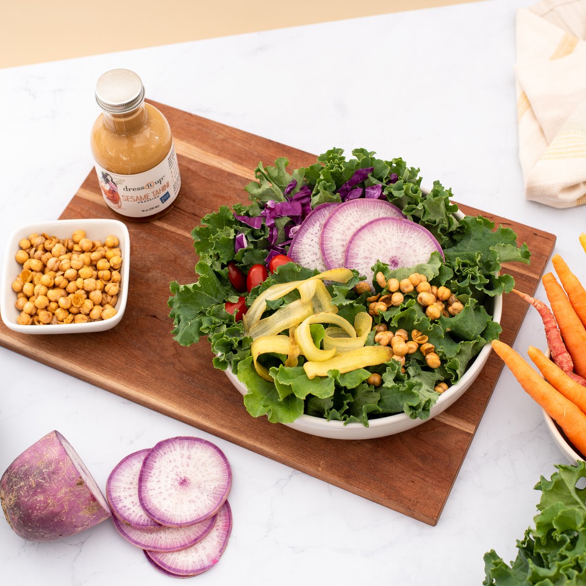A successful weekend trip to your local farmers market means your Monday looks like this. 👇🤤 Crisp greens and ripe veggies provide an ideal base for our bold and tangy Sesame Tahini dressing. 🥗 Shop the sauce: dressitupdressing.com/collections/all