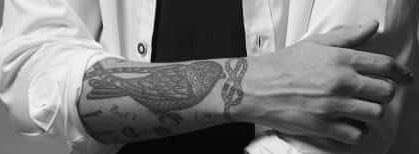 The Tattoo arm I vote  #Louies for  #BestFanArmy at the  #iHeartAwards