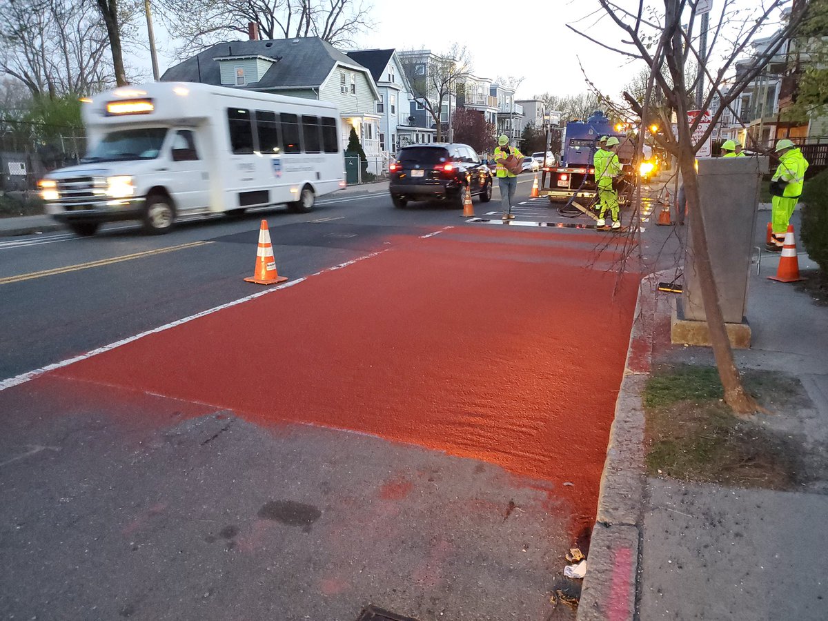 BostonBTD's tweet photo. Good morning #Roslindale. Did you notice that the Washington Street Bus Lane got some ruby red paint last night? #teambtd is in full swing doing pavement markings across the city. #KeepingBostonMoving. https://t.co/N013M0CnLp
