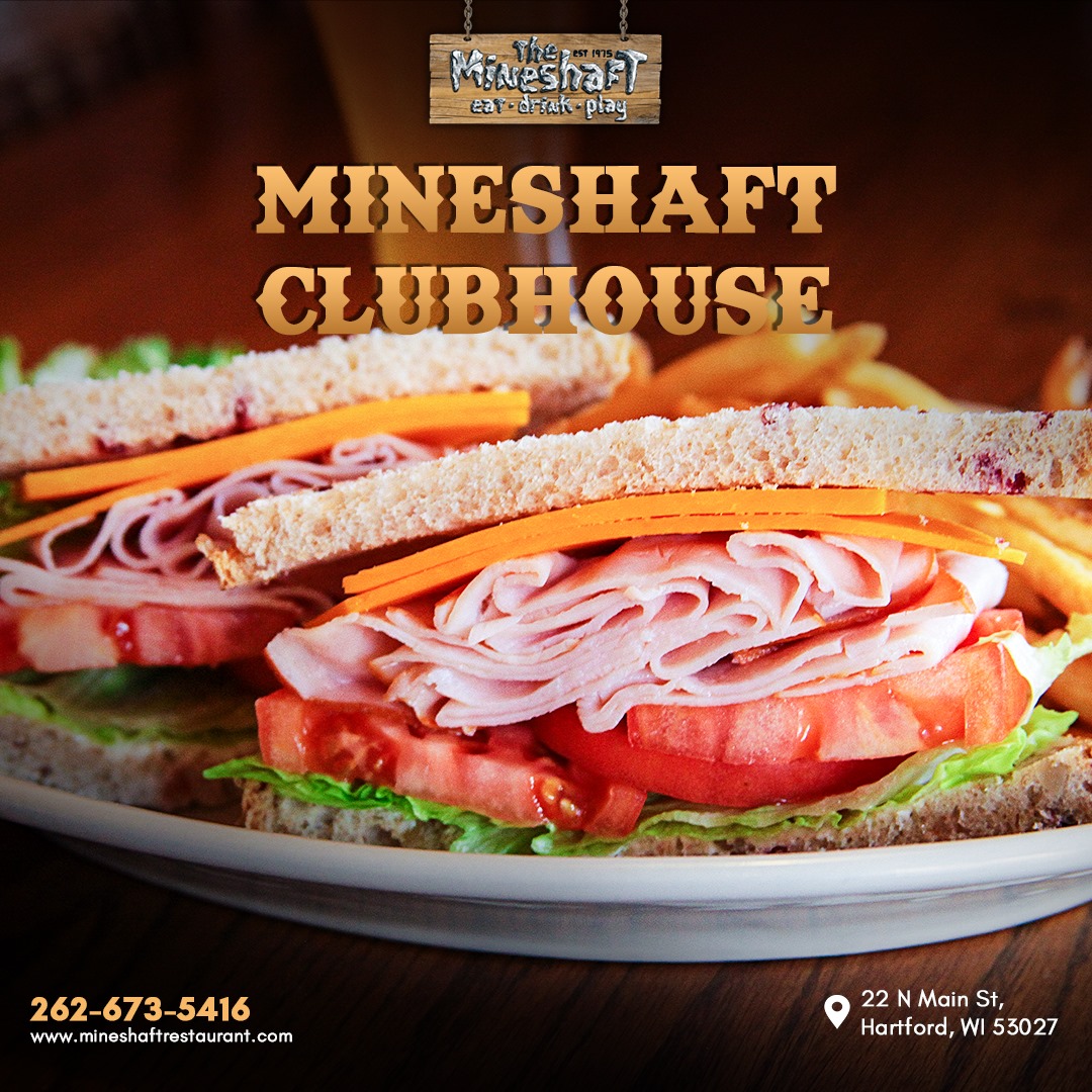 Triple decker with sliced turkey, bacon, lettuce, tomato and mayo served on toasted white bread