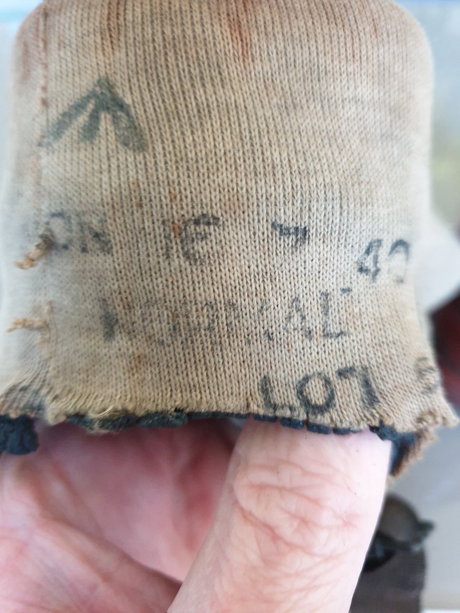 There are test date stamps and Lot numbers on the underside. The lot numbers meant that if a Respirator was found to be faulty the entire batch could be withdrawn. "Normal" is the size reference. There seems to be no maker reference... 5/