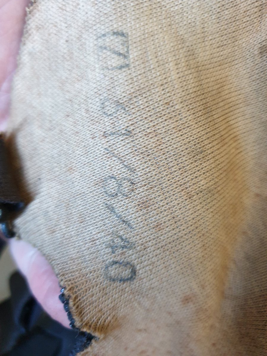 There are test date stamps and Lot numbers on the underside. The lot numbers meant that if a Respirator was found to be faulty the entire batch could be withdrawn. "Normal" is the size reference. There seems to be no maker reference... 5/