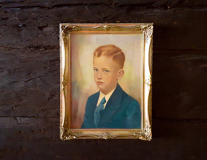 For as long as I can remember, an oil painting hung above the escritoire of my grandmother, a smooth face untouched by age, a bland, conventional depiction of eternal youth with the unconcerned, unblinking gaze of the semi-profile portrait.