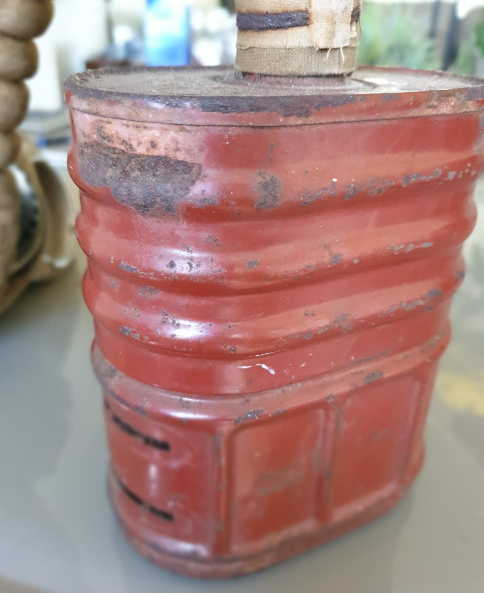 This is the filter container, model E Mk VI as evidenced by the brick red colour and manufactured from March 1940 on which ties in with the other dates. The slots are the air inlet. Most were made by Barringer, Wallis & Manners, a biscuit tin manufacturer 6/