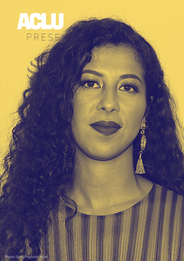 Portrait of a woman of color taken straight-on and from the shoulders up. She is gently smiling. Her hair is long and curly and she is wearing lipstick and earrings. There is a white ACLU logo in the top left corner. Photo credit is given to Getty/Nicholas Hunt