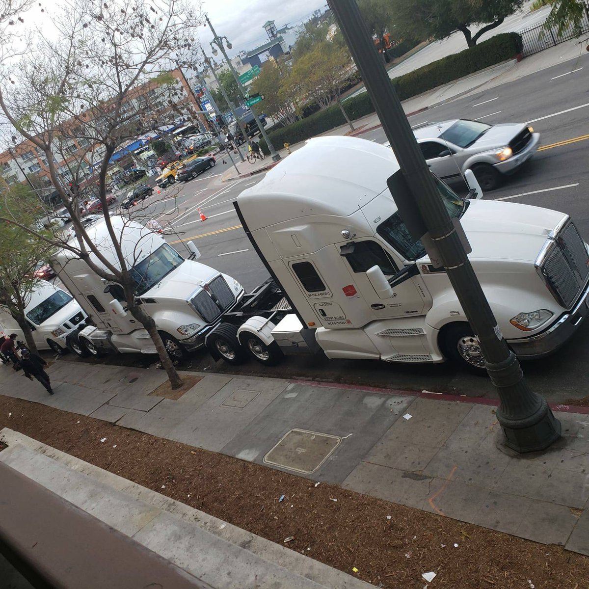 After our interview, Ash texted me a few photos their girlfriend took of the bus stop on Caesar Chavez & Alameda showing multiple semi trucks blocking the stop. They believe the trucks were from the Oscars.