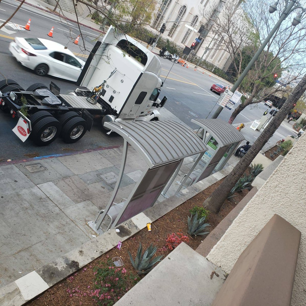 After our interview, Ash texted me a few photos their girlfriend took of the bus stop on Caesar Chavez & Alameda showing multiple semi trucks blocking the stop. They believe the trucks were from the Oscars.