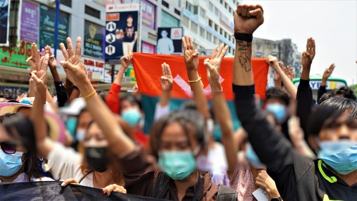 Myanmar_Now_Eng's tweet photo. Youths in Yangon marched against military dictatorship this afternoon (Apr 26) near Mingalarzay, under the banner, “(We) will clear all the danger/enemies”, a play on the city’s name in Myanmar ရန်ကုန် which is often translated as “end of strife”. 

#WhatsHappeninglnMyanmar https://t.co/vqAj5nQpoi