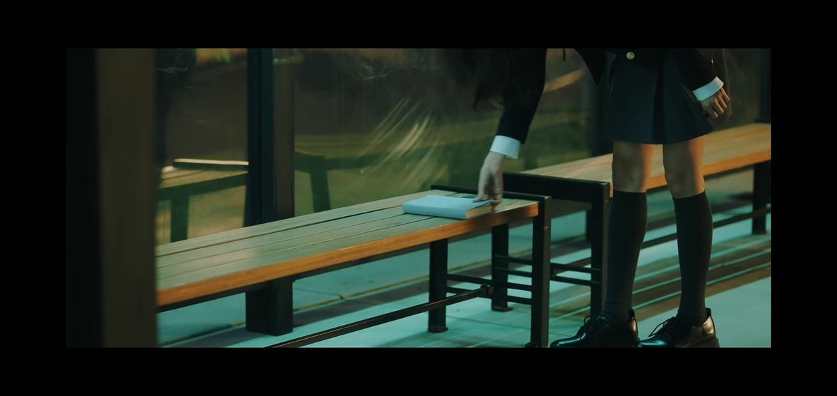 2. Then a girl appears at the bus stop and sees that a book is left there and she opens the book and sees an invitation about the party. (NOTE: She herself isn't really invited but saw the invitation) from 0:27  #ENHYPEN    #ENGENE  #ENHYPEN_COMEBACK_DAY