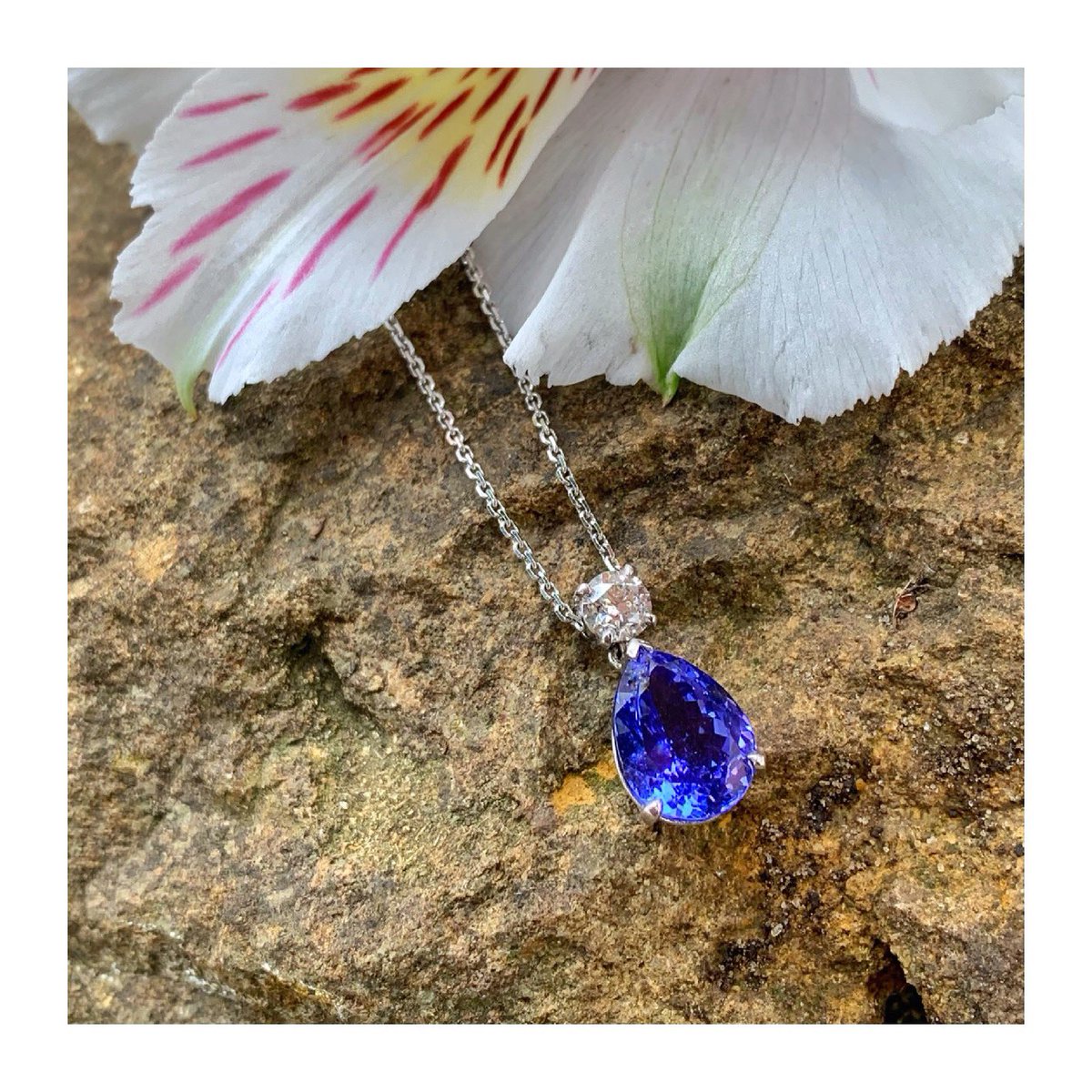 Hand-crafted around a beautiful #tanzanite, this claw set #pendant is topped with a sparkling #brilliantcut #diamond. #supportlocal #guildfordjeweller #isupportguildford #guildford #independentjeweller #loveguildford #diamonds #tanzanites #tanzanitependant #handmadejewellery