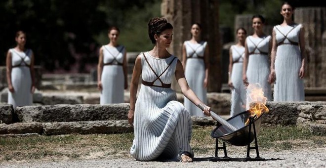 In case you dont know, for every Olympic Games, a few months before starting, there is a traditional ceremony in Olympia, Greece, where the olympic flame is litted using only a parabolic mirror(which is fucking awesome from a geometric/physics view, but that's not the point now)