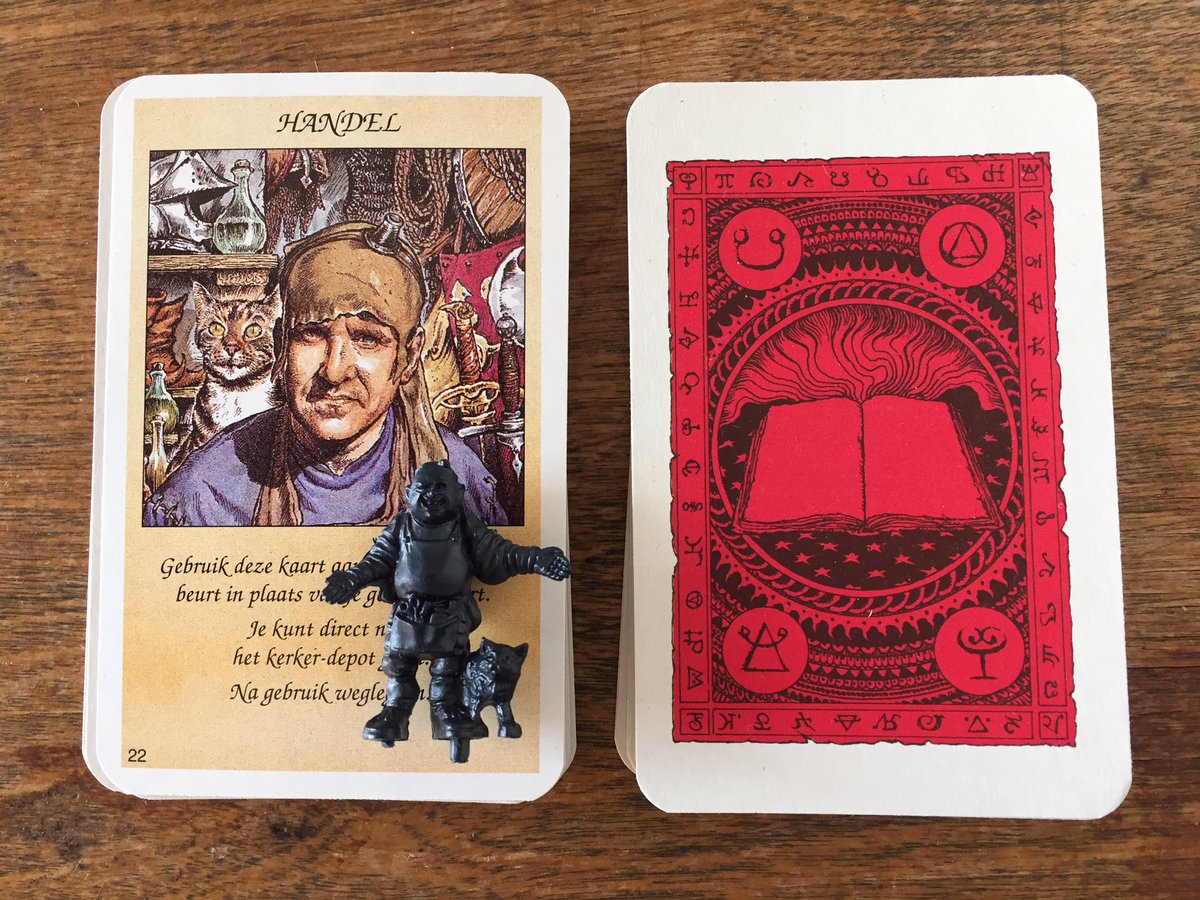 Artist mcKenna drew the shopkeeper after the writer on the bookcover, Ian Livingstone of Games Workshop fame, who also designed the boardgame. Making it perhaps the only boardgame where its designer is also featured as a mini?