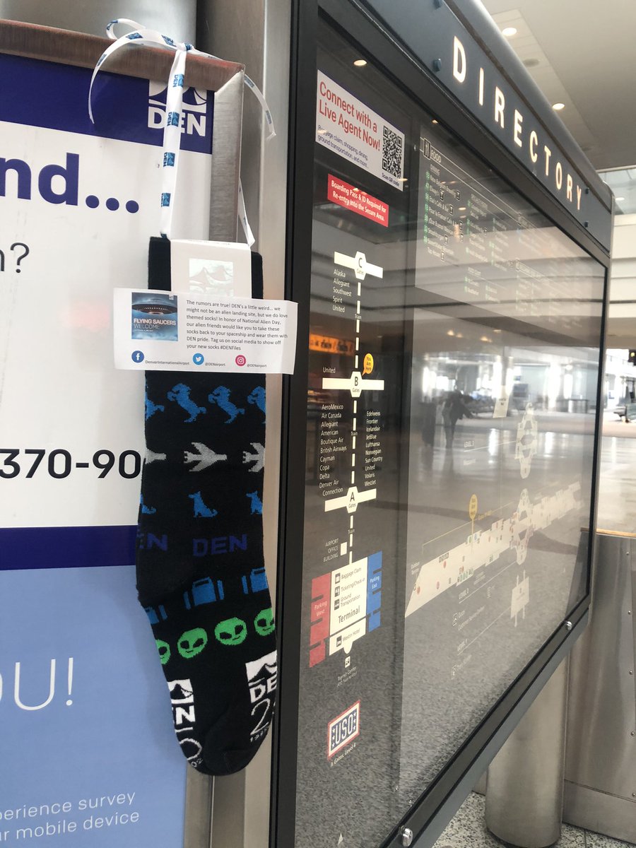 DENAirport's tweet photo. Aliens have beamed down DEN branded socks for passengers to celebrate #NationalAlienDay! There are 20 🧦 hidden throughout the airport. Be sure to tag us in your sock pics! #DENfiles 🛸👽 https://t.co/vBU7fVGiDg