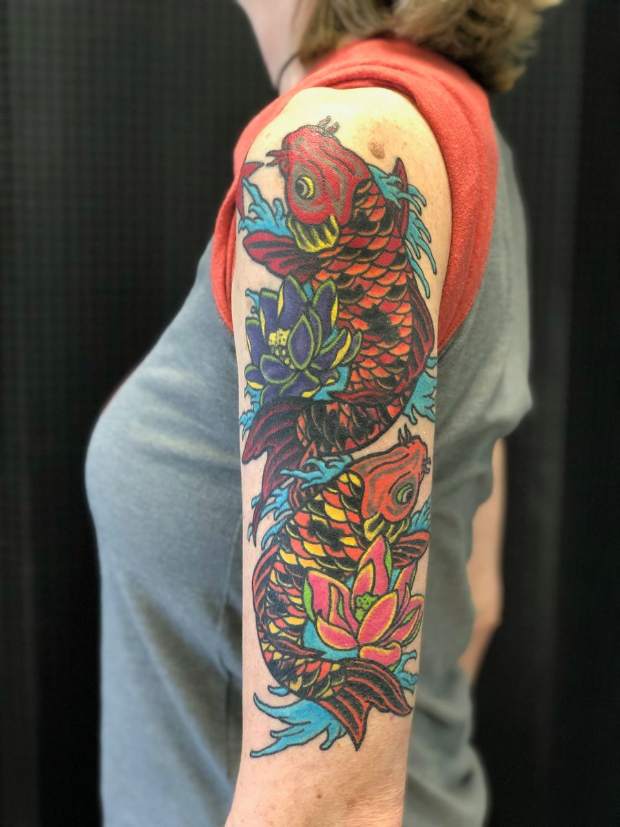 The Stories Behind  #MyTattoos24. 2 koi fish and 2 lotus flowers - Feb/Mar 2019I was super excited to do a large color piece. Normally my tattoos are black and gray but for this, I knew color would be cool and dramatic. 