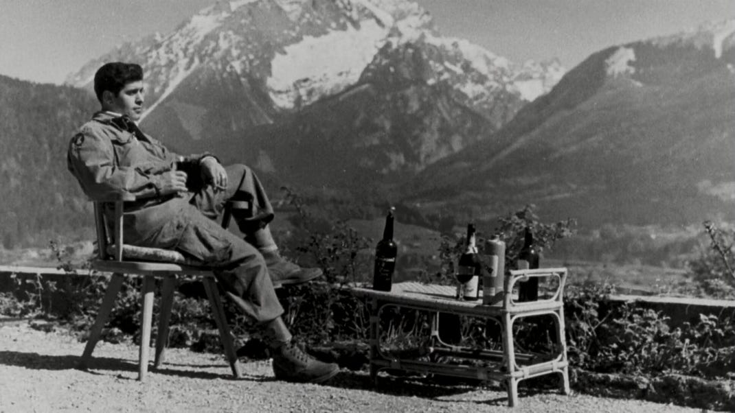 American paratrooper drinks Hitler’s cognac on patio of his Alpine retreat at Berchtesgaden, spring 1945:        #NARA