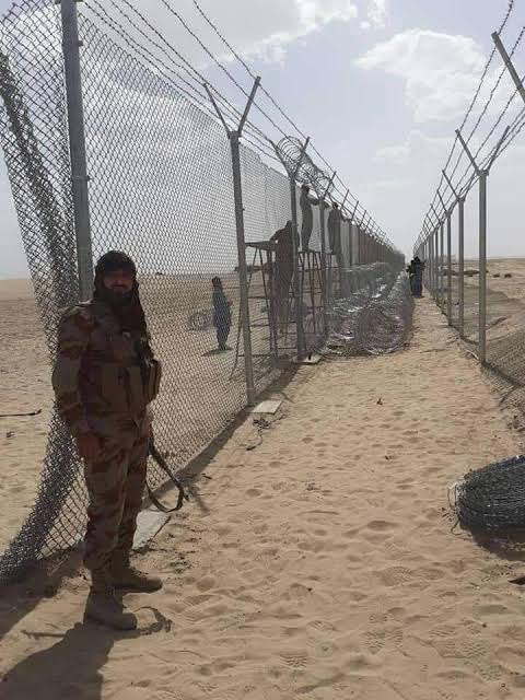 Barrier consists of 2sets of chain-link fences, seprtd by a 2-metre(6-foot) space filled with concertina wire coils. fence is 3.6 metres high (11 feet)on the Pak side and 4 metres high (13 feet) on the Afghan side and is fitted with surveillance cameras and infrared detectors 3/6
