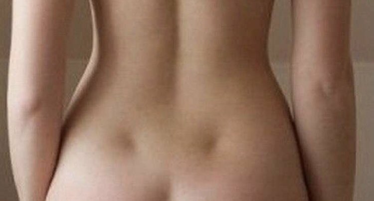 Why do Girls Have these Holes In Their Back???