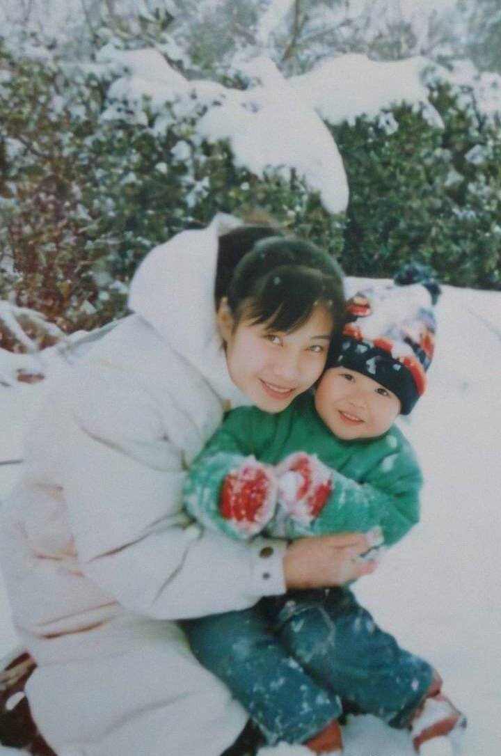 2. playing with snow, falling on his butt, his mom picked him up to wiped it all, then she hugged him to take a photo and he smiled like a little sunshine 