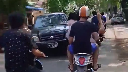 KhinMyoKyi2's tweet photo. The moment it looks like this car crashed into Myanmar protest leader Wai Moe Naing riding a motorbike in Monywa before he was grabbed and arrested.
 #WhatsHappeningInMyanmar 
#WeNeedJustice 
#RejectMilitaryCoupInMyanmar https://t.co/XhkJWb0KLE