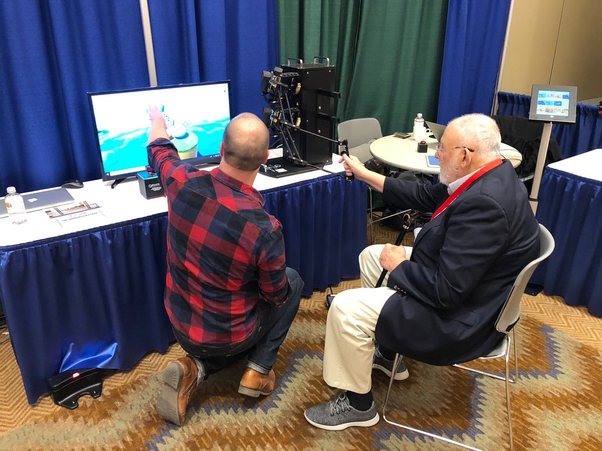 #TBT to when in-person conferences and exhibits where a thing. Legendary Cleve Moler, developer of #MATLAB and co-founder of MathWorks, stopped by one of our booths and tried out some of our #robotics hardware running with #Simulink.