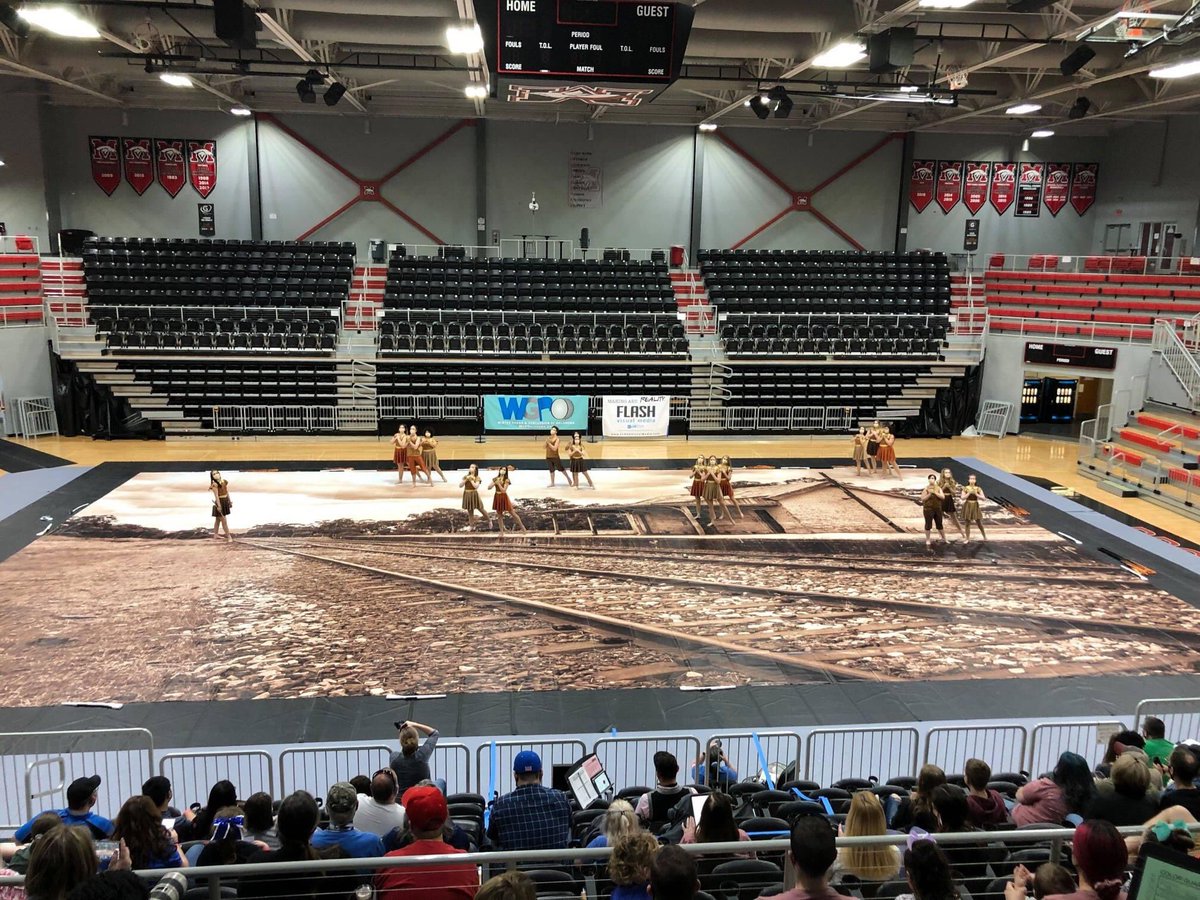 Pictured is Mustang HS (OK) using their FLASH tarp at the recent WGPOklahoma West Championships.  FLASHVisualMedia.com 
#flashvisualmedia #makingartreality #marchingarts #wgi2021.