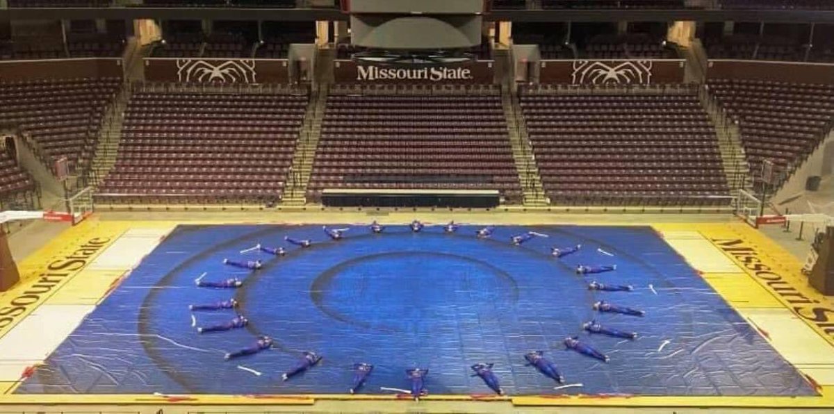 Pictured is the Pride of Missouri State winter guard using their FLASH tarp and flags at a recent performance.  FLASHVisualMedia.com 
#flashvisualmedia #makingartreality #marchingarts #wgi2021