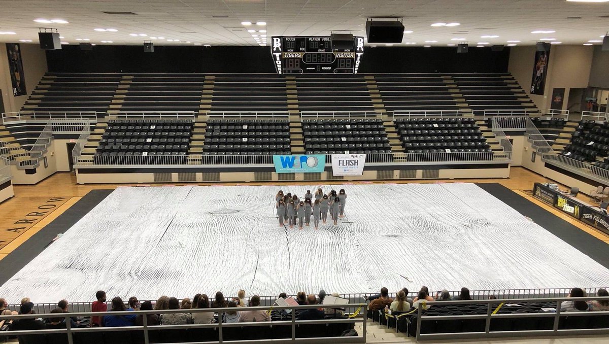 Pictured is Owasso HS (OK) using their FLASH tarp and flags at the recent WGPOklahoma East Championships.  FLASHVisualMedia.com 
#flashvisualmedia #makingartreality #marchingarts #wgi2021