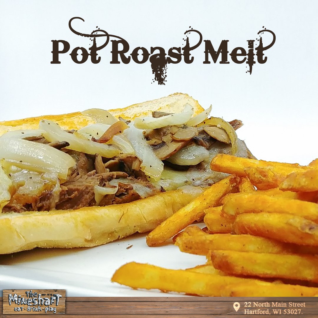 Tender pot roast with garlic mushrooms and onions with Provolone Cheese on a Hoagie.