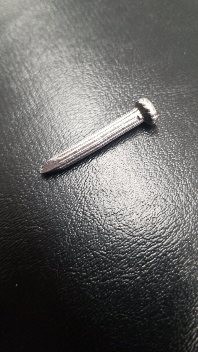 PatNorem's tweet image. I have carried this nail with me since 2004. A special group of people know why. My daily ritual of placing this in my pocket is second nature. TSA didn't quite understand why it was in my pocket; no way I was giving up my nail. #CarryTheNail