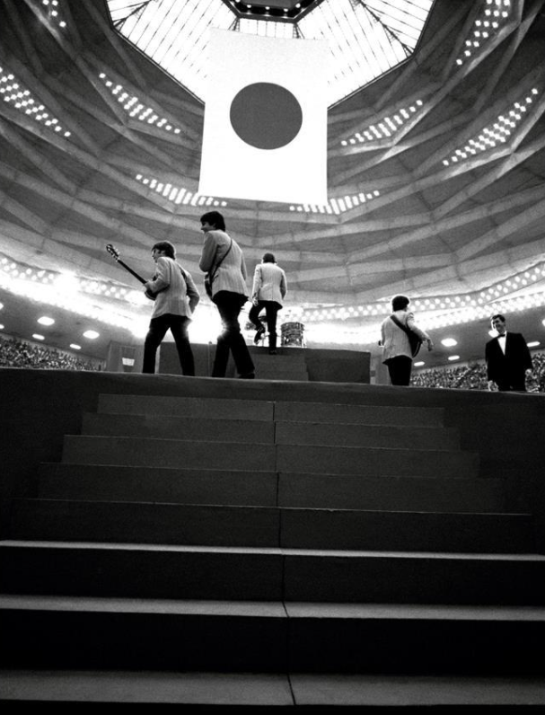 The Beatles ascend the steps to the stage at Tokyo's Nippon Budokan for a matinee concert, 1966. 📷 Robert Whitaker.