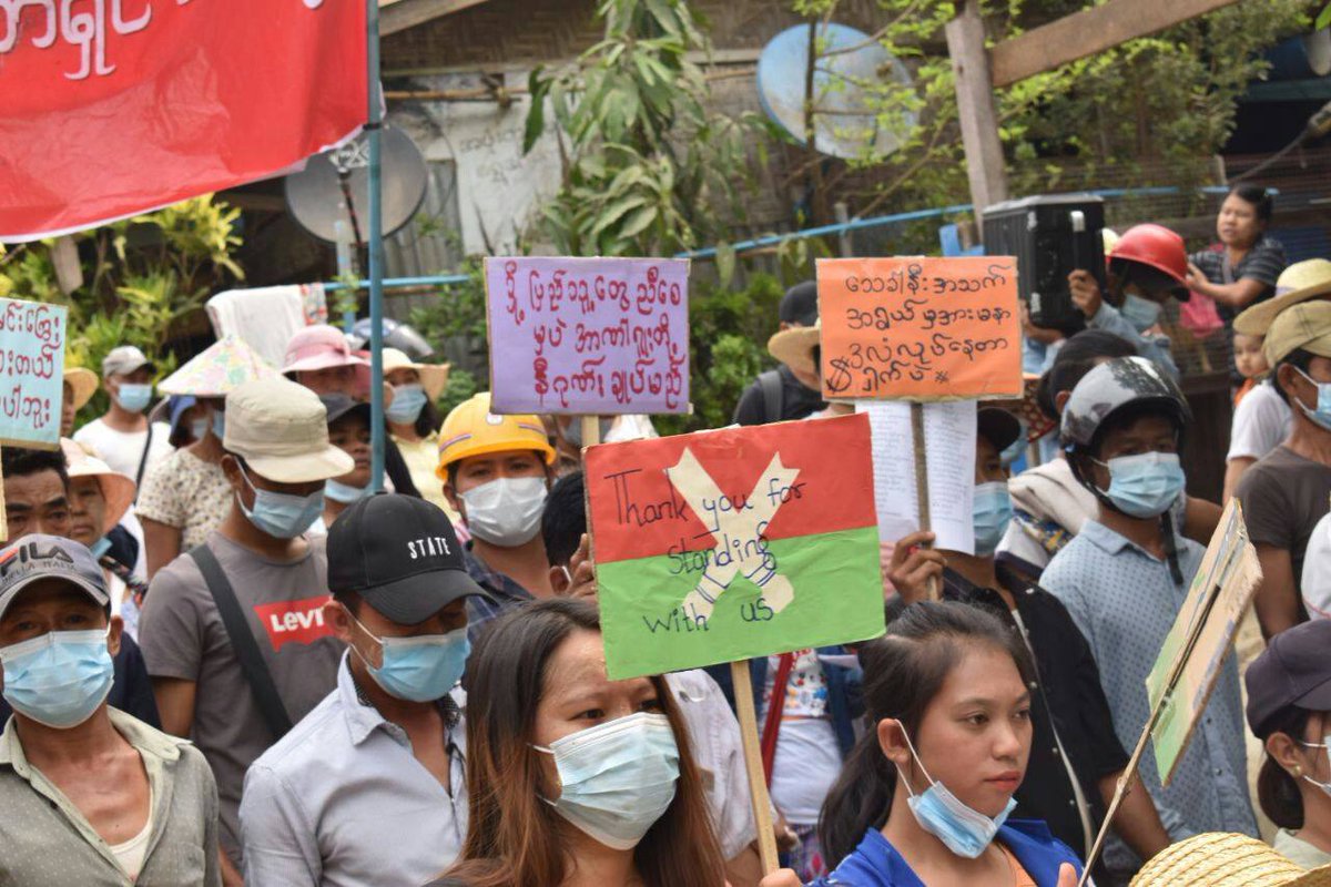 Myanmar_Now_Eng's tweet photo. Residents of Hpakant, #Kachin, known for its jade mines, marched against the military dictatorship today (Apr 16). They also held signs thanking the Kachin Independence Army (KIA) for attacking and seizing the positions of the Myanmar army. #WhatsHappeningInMyanmar https://t.co/5ILS8kzmbz