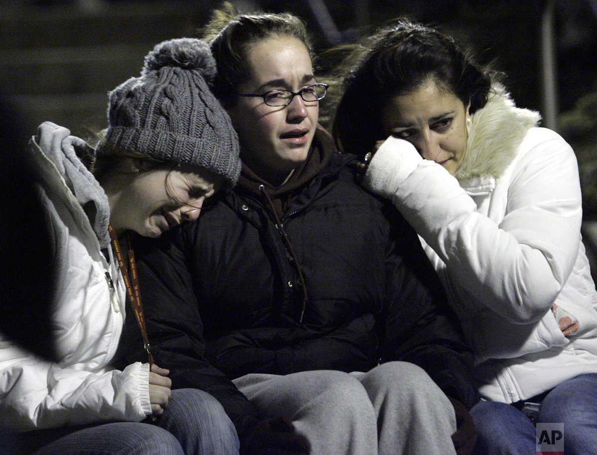 #OTD in 2007, in one of America’s worst school attacks, a college senior killed 32 people on the campus of Virginia Tech before taking his own life. Students console each other after a memorial service at War Memorial Chapel near Norris Hall, the site of a shooting on campus.
