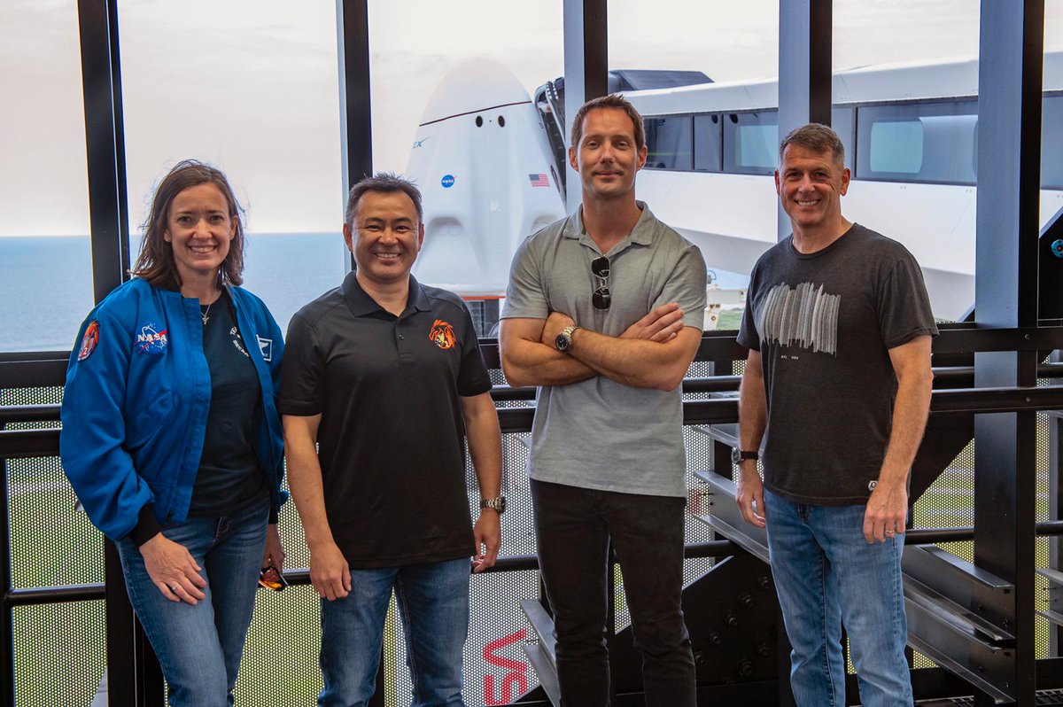 Crew2 in front of Dragon spacecraft on top of Falcon rocket