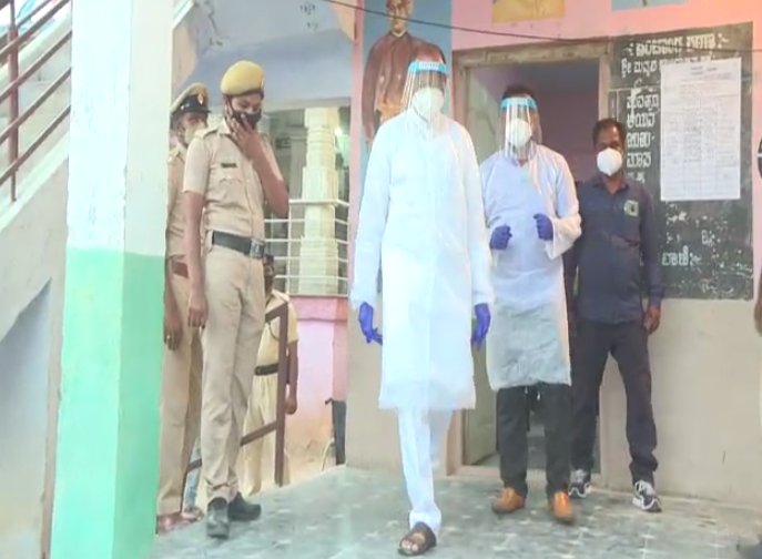 ANI's tweet image. Karnataka: BJP candidate Pratap Gowda Patil, who has tested positive for COVID-19, casts his vote in bypoll for Maski Assembly constituency in Raichur district.